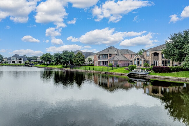 Cinco Ranch's lakefront homes offer serene views of its shimmering waters.