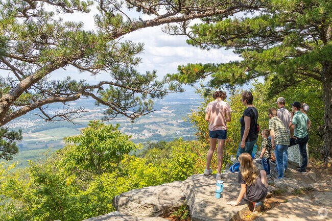 People gather at Massanutten Peak near Crossroads Farm to take in the spectacular views.
