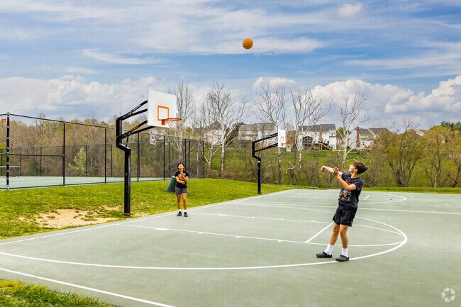 Residents can practice their basketball skills on the courts of Spring Ridge Park.