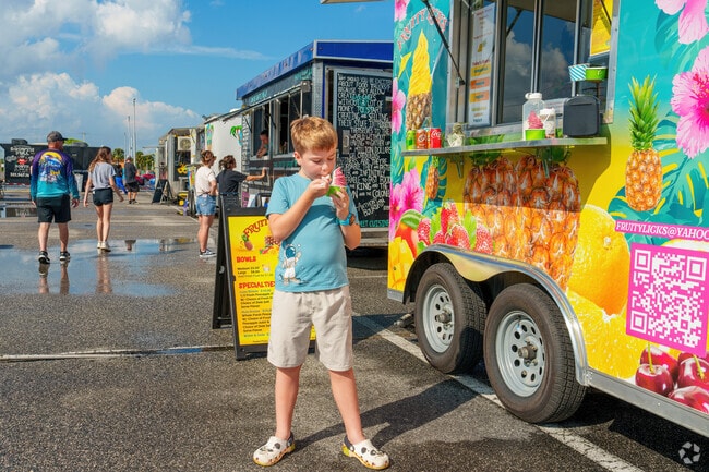 A young Merritt Island resident enjoys a Dole twist at the monthly Food Truck Festival.