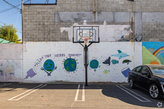 There is a basketball hoop in the back parking at Acton Academy in Venice, CA.