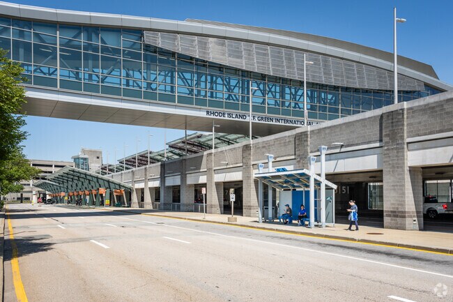 Travelers are waiting at the bus stop at T.F. Green International Airport in Warwick, RI.