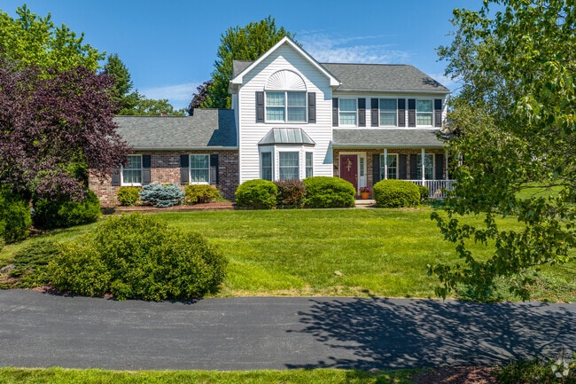 Bath modern Craftsman homes feature winding driveways and garages for private parking.