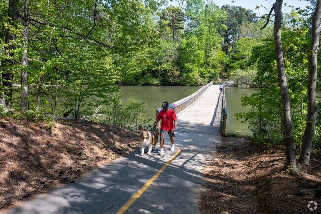 Reserve at Lake Lynn residents enjoy the beauty of nature with their furry friends while walking the trails.