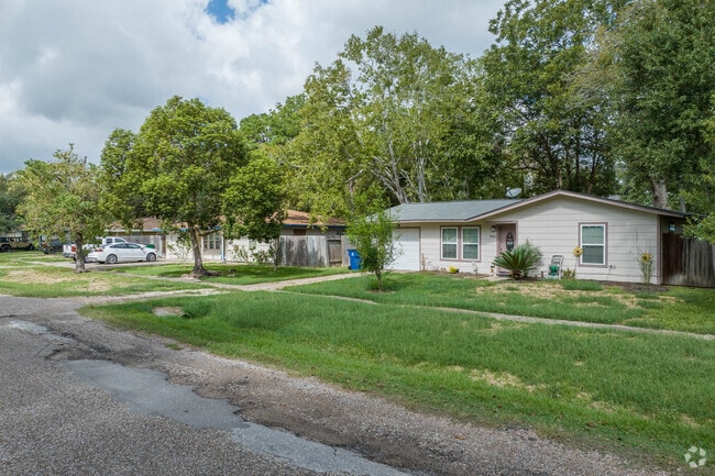 A row of three-bedroom homes sits along a quiet street in Angleton.