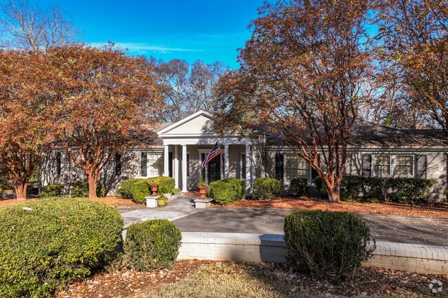 Homes such as this Greek Revival Inspired Rancher have horseshoe driveways for easy parking.