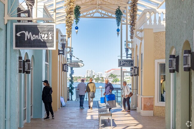 The Venetian Village Shops nearby to Park Shore has high end shopping on the water.