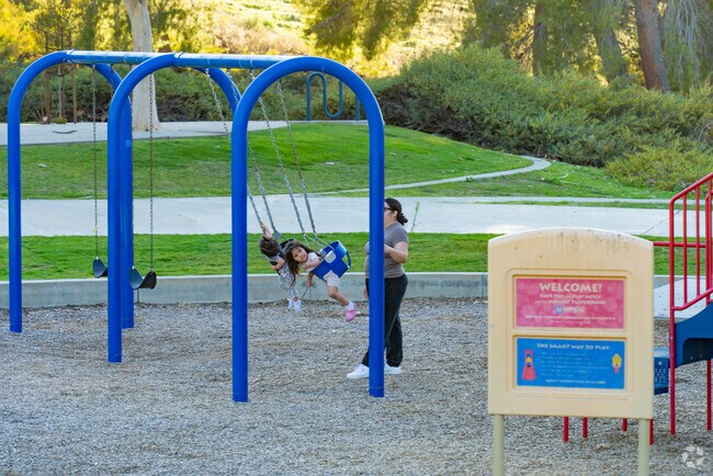 People gather at Meadowridge Park in Golden Triangle North to walk, relax, and connect in Murrieta.