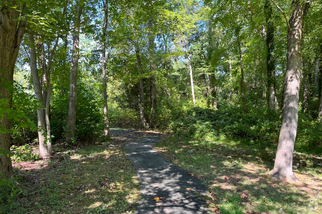 Enjoy the outdoors shaded by trees on one of Burke Centre's many walking paths.