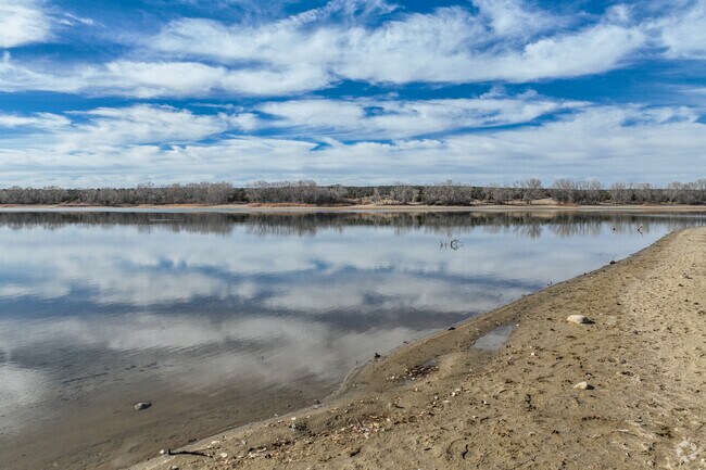 Locals enjoy the beach at Lake Farmington to sit back and enjoy warm sunny days.