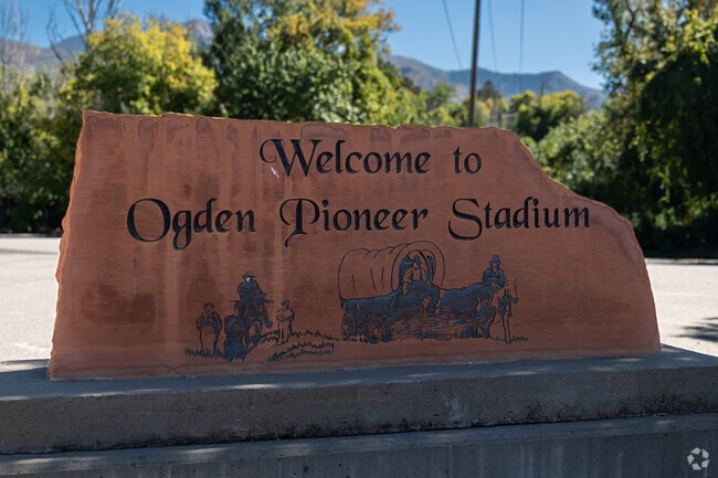 A stone sign welcomes visitors to Ogden Pioneer Stadium.