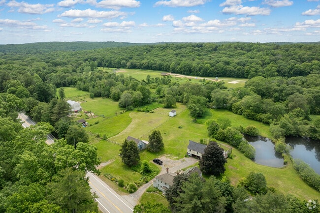 From above, you can see that the Ashford town houses are nestled among open farmland and lush greenery.