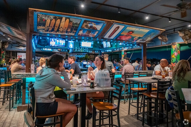 Hula Bay Club offers waterfront dining with a Hawaiian flavor.