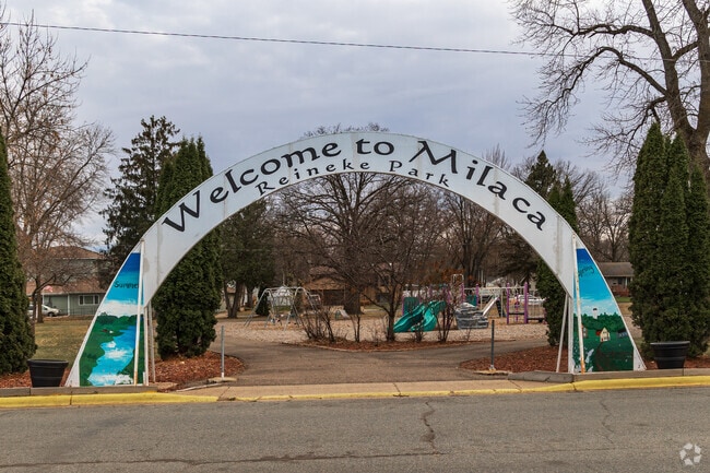 Stroll under the big white archway at Reineke Park — Milaca welcomes you with style.