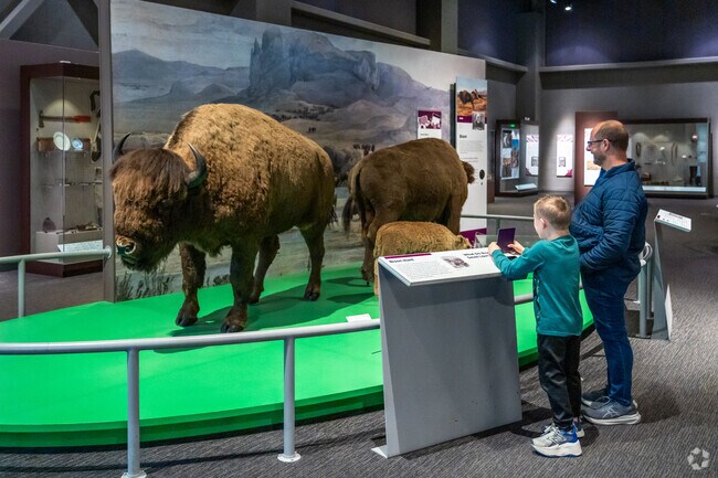Visitors view Native American exhibits at the North Dakota Heritage and State Museum.