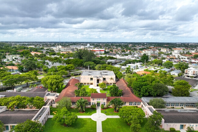 Miami Springs Elementary School is surrounded by lush greenery.