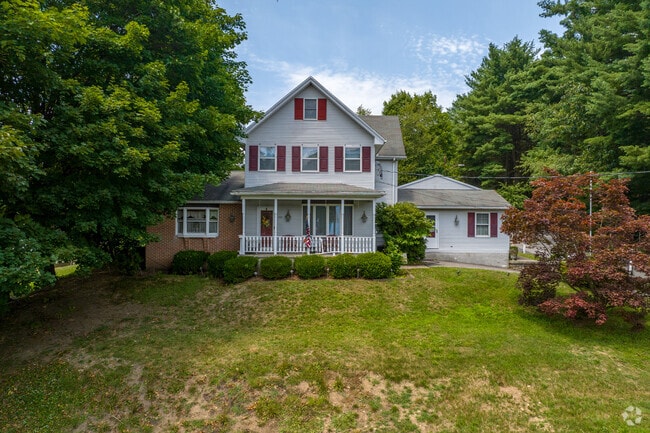 Three-story single-family homes sit atop hills in Jalappa.