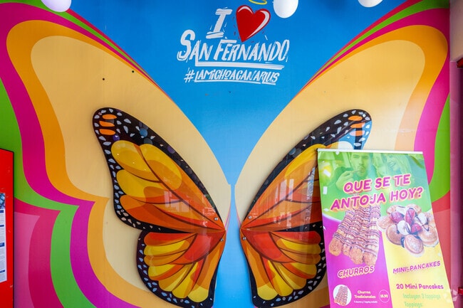 At La Michoacana in San Fernando, a vibrant mural of butterfly wings captures the essence of local pride and community spirit.