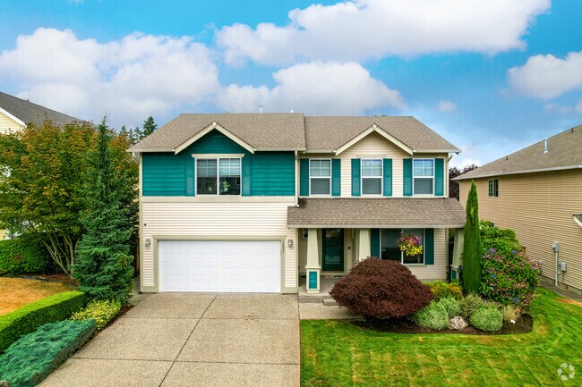 A stunning green and white split-level home in Fairwood.