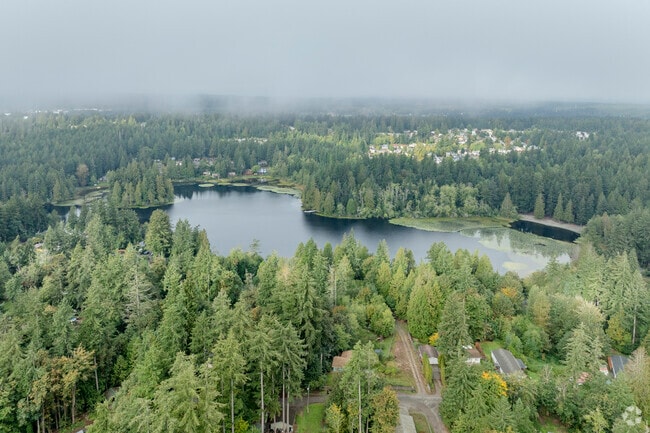 Island Lake sits below fog & clouds in The Summit WA.