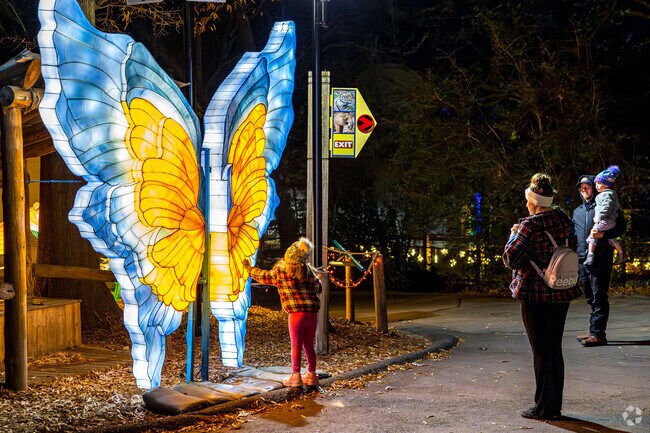 Kids can interact with giant sculptures at IllumiNights at the Zoo in Grant Park.