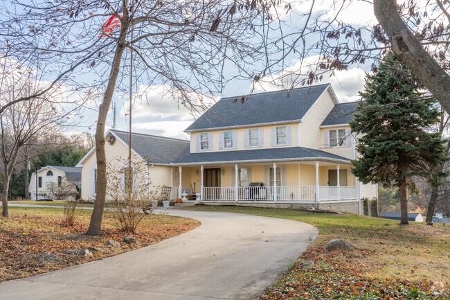 Large farmhouses with wrap-around porches are perfect for large families who host.