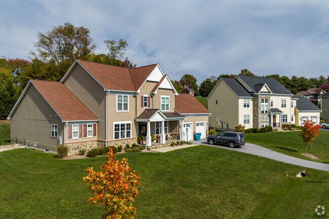 Many homes in Holly Hills feature long driveways and two-car garages.