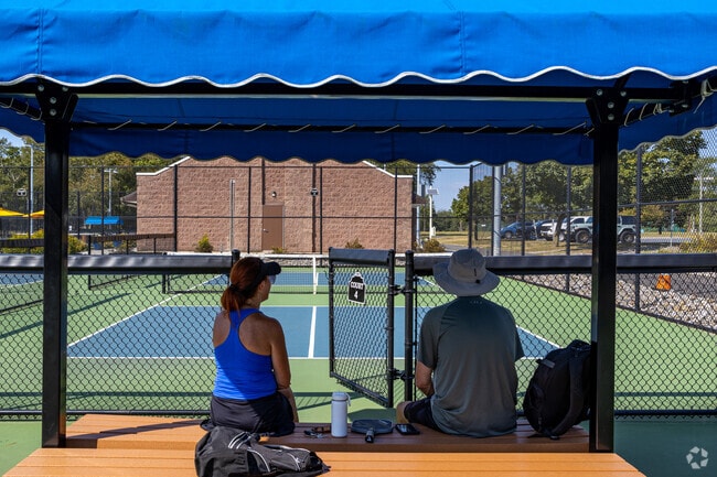 Play a game of pickle ball and take a water break in the shade