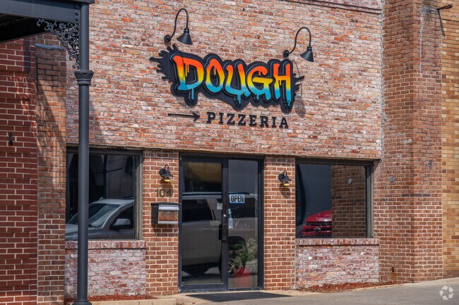 Grab a slice of pizza at Dough Pizzeria and see why Ward Heights residents flock to the popular pizza parlor.