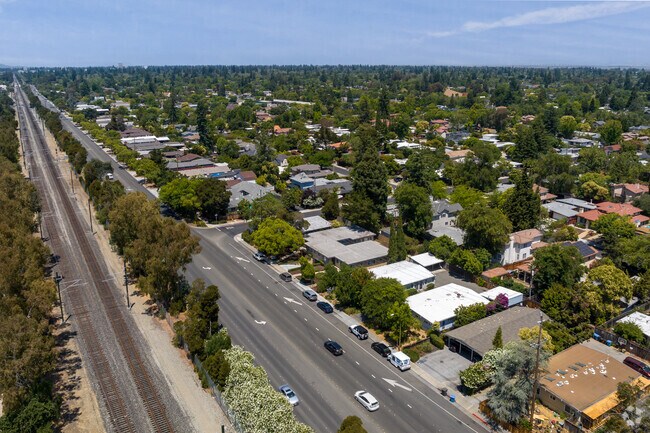 A quiet road separates train tracks from the tree-lined homes of Palo Verde.