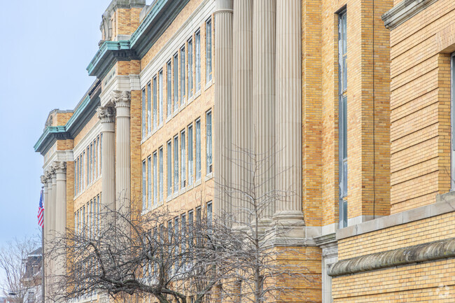 The exterior of the Lawrence High School with it's large columns and brick in Lawrence, MA.