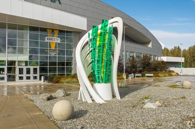 A modern sculpture adorns the entrance to the Alaska Airlines Center in the University Area.