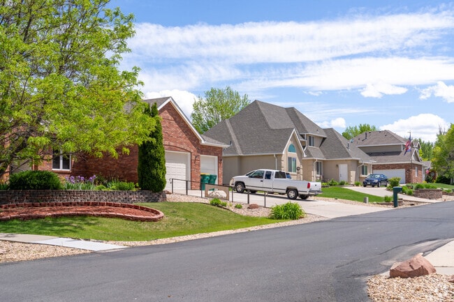 A row of modern Cape Cod homes in Westridge blends classic charm with contemporary design, featuring open layouts, vaulted ceilings, and HOA-maintained landscaping for effortless living.
