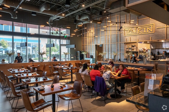 The indoor dining area at Taikin Asian Cuisine provides a sleek and modern atmosphere.