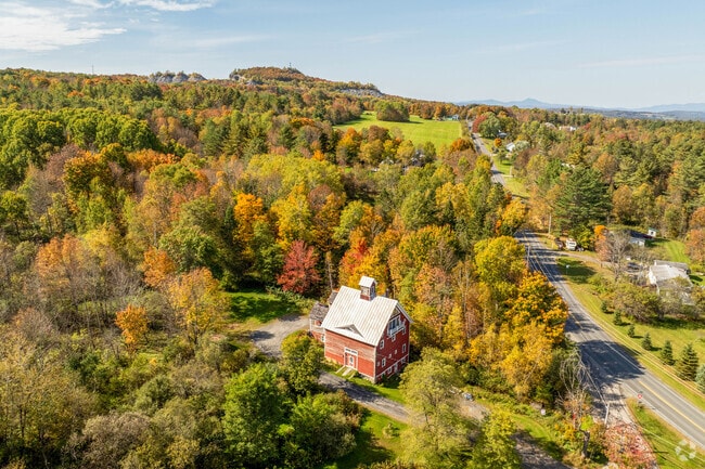 A charming farmhouse, nestled on a hillside in East Barre has views of the surrounding area.