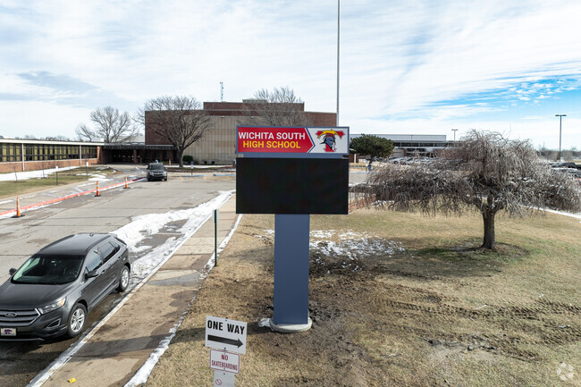 There is a sign for Enterprise Elementary School near the main road.