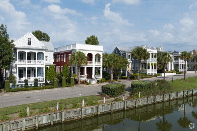 Homes in I'On feature Lowcountry charm with lush landscaping and porches.