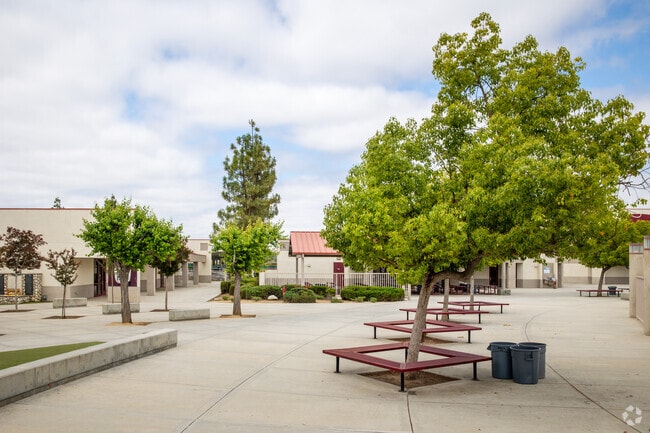 Benches built under trees provide shade at Paloma Valley High School in Menifee.
