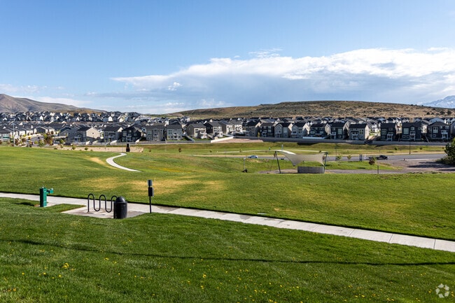 Silver Lake Amphitheater Park offers plenty of green grass and open space right next to Eagle Mountain homes.