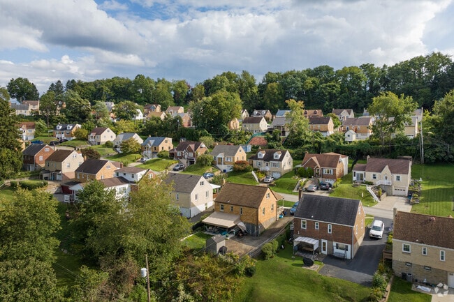 Castle Shannon's homes glow warmly under the setting sun.