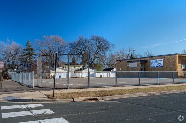 Holy Trinity Elementary School has an asphalt play area behind the school.