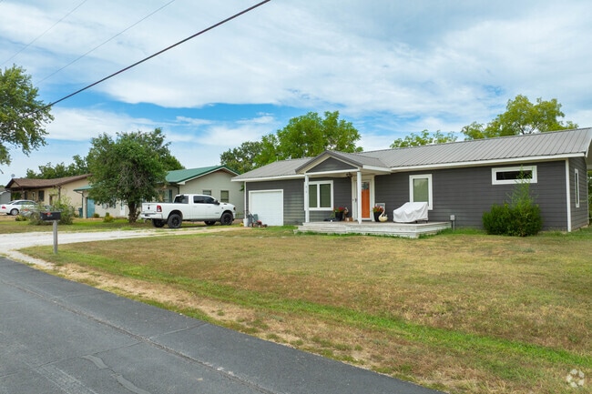 Ranch-style home offers single-level living near the lake.