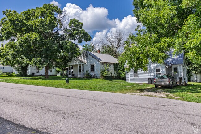 Homes in Stover sit on leafy lots shaded by large trees.