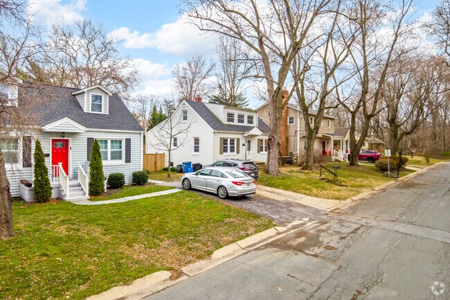Cape Cod homes from the midcentury era line South Four Corners blocks.