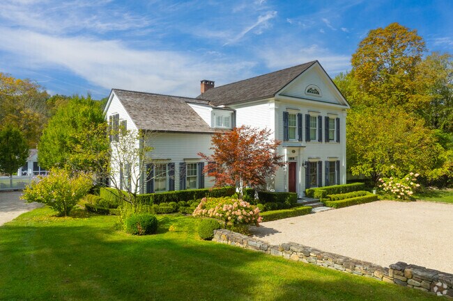 Well-kept Colonial homes are nestled within the greenery of Cornwall.