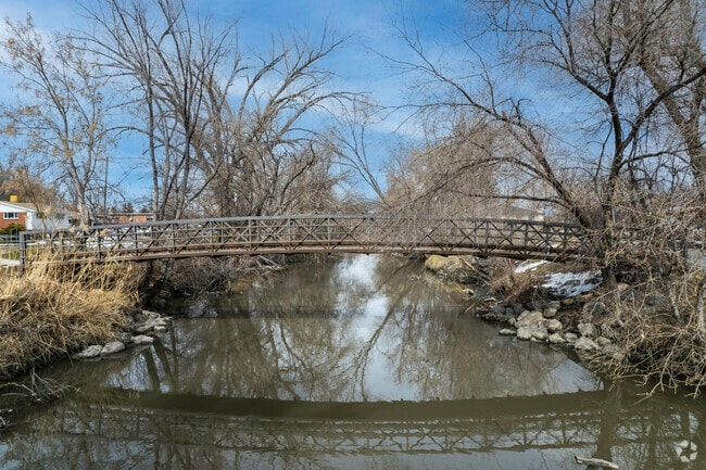 A scenic stream and bridge add to the charm of Riverside Park.