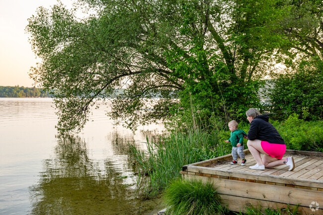 A small dock at Almira Township Lakeside Park gives residents peaceful sunset views of Lake Ann.