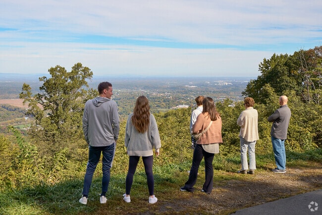Visitors pause on Skyline Drive to take in sweeping views over Front Royal and Warren County.
