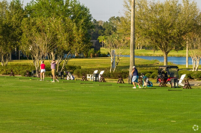 Work on your swing at the driving range along the golf course in the Solivita region.