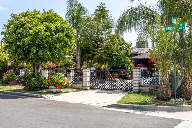 Lushly landscaped single-family ranch-style home nestled among trees and flowers in Carvedale.